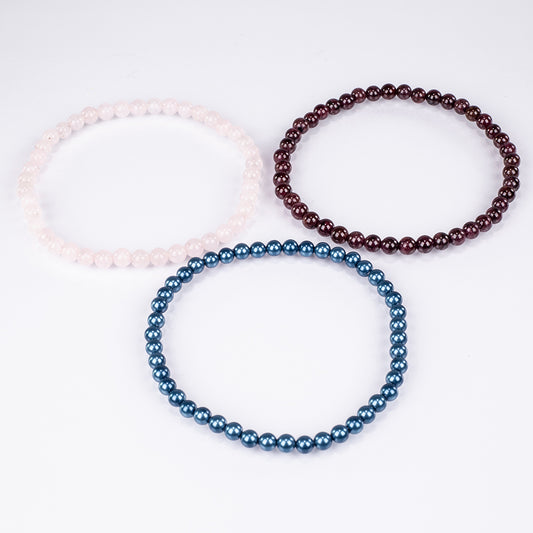 Setti Ruusukvartsilla ja Punaisella Granaatilla ( Rannekoru )