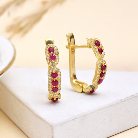 Kullatut hopeat Korvakorut Malagassin Rubiinilla ja Valkoisella Topaasilla